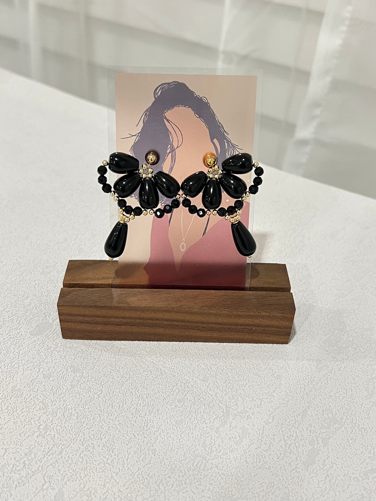 Black agate waterdrop earrings on a portrait card