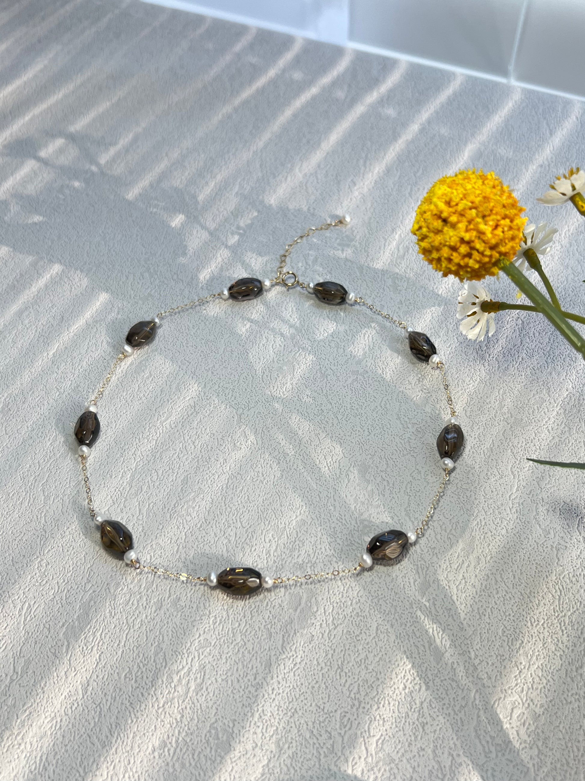 Smoky quartz & pearl choker necklace decorated with yellow flowers