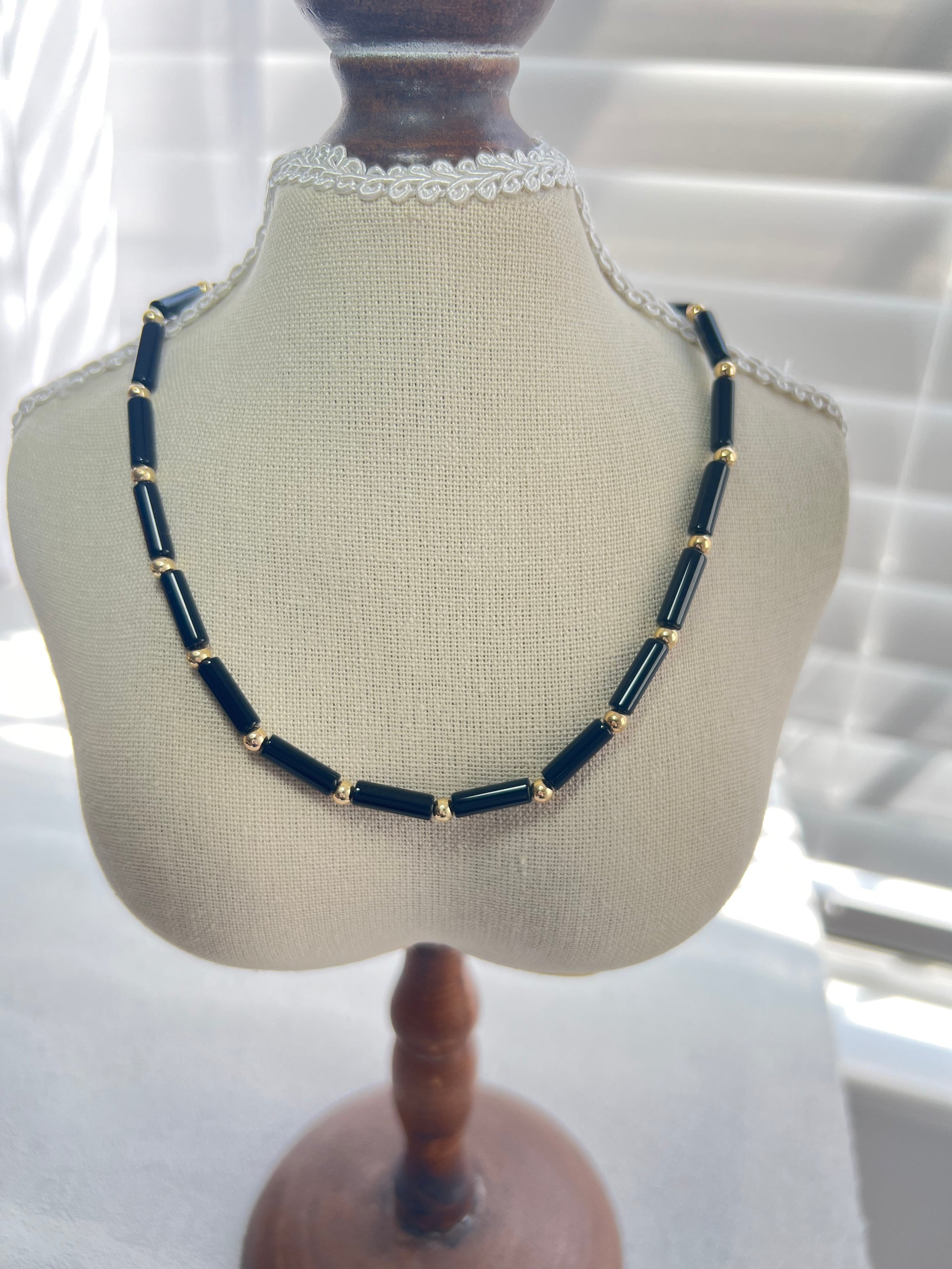 Black agate choker necklace on a small mannequin