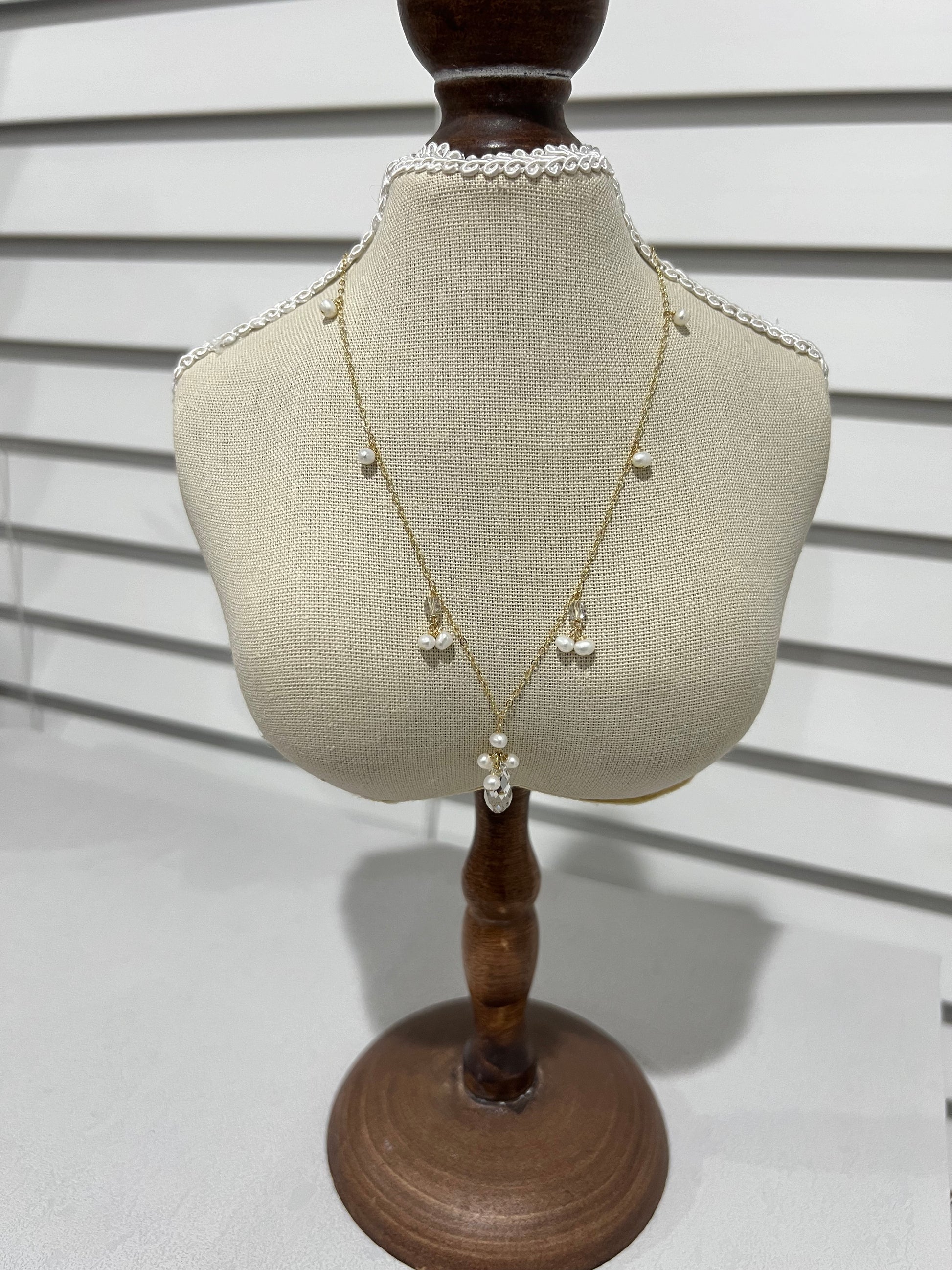 Swarovski crystal & pearls necklace on a small mannequim